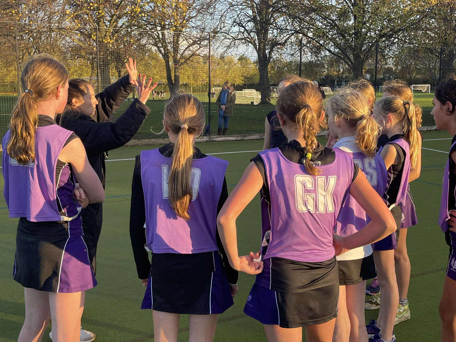 Top, Hannah Pullen and, above, the half time team talk