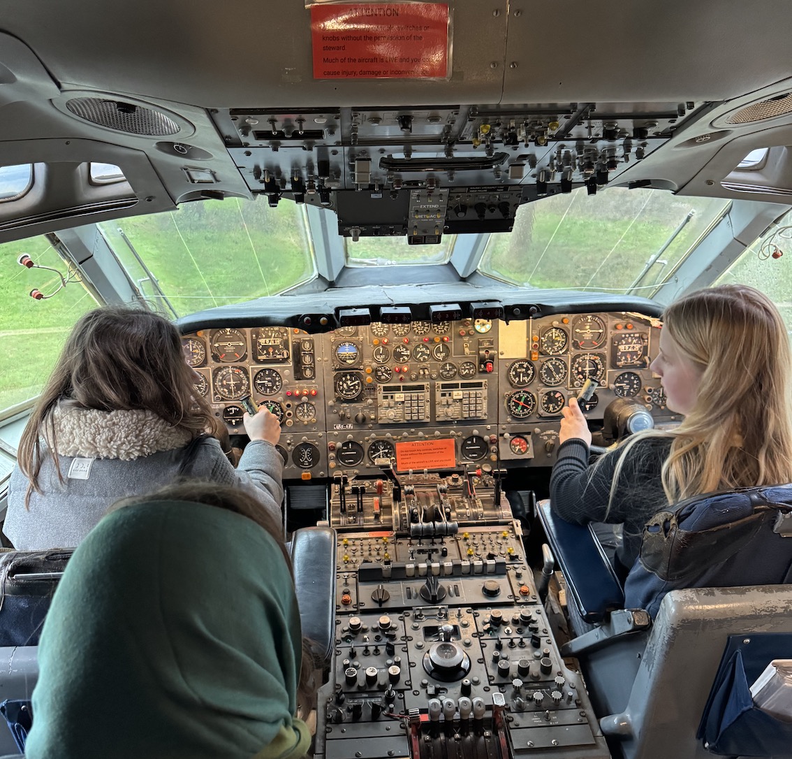 Girls at controls of Jet airliner 