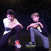 Boys posing mid dance